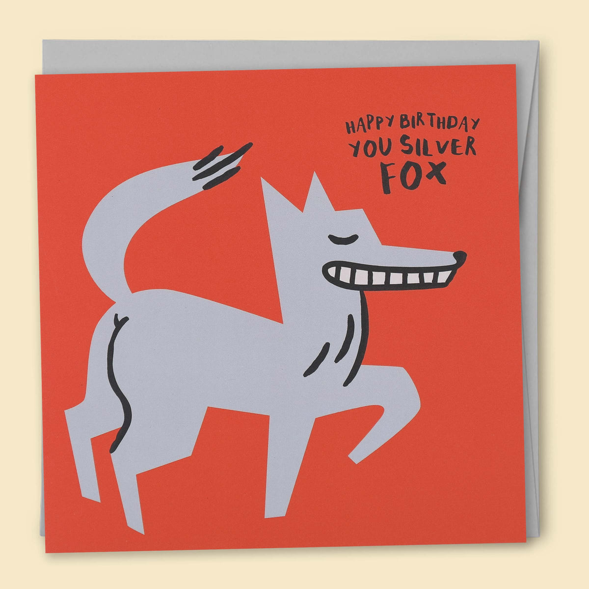 A greeting card with an illustration of a fox on a red background, with the text 'HAPPY BIRTHDAY YOU SILVER FOX' — Australian-made greeting card by Papernest