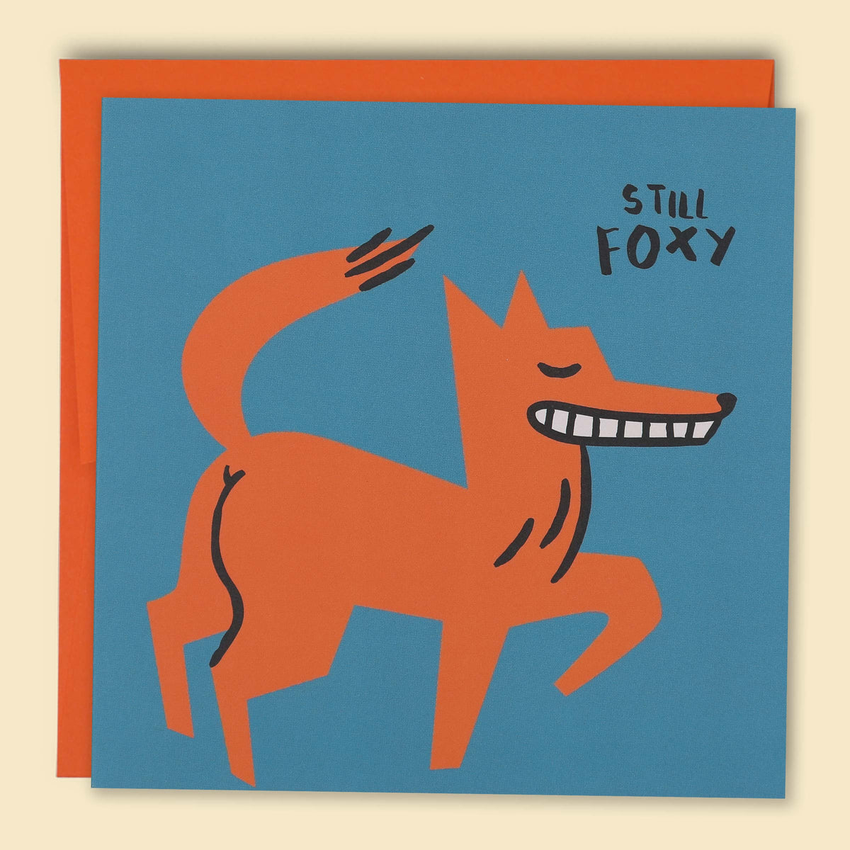 A greeting card with a cartoon illustration of a fox on a blue background, with the word 'Still' and 'Foxy'. Australian-made greeting card by Papernest