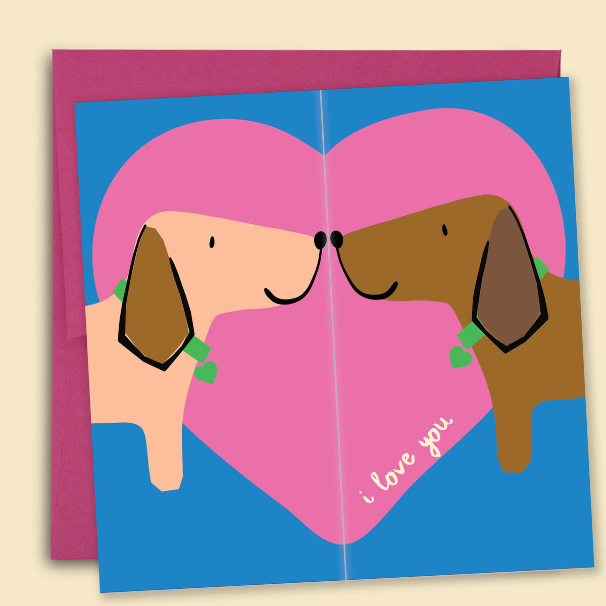 A greeting card with an illustration of two dachshunds on either side of a pink heart, with the phrase 'I love you' at the bottom — Australian-made greeting card by Papernest