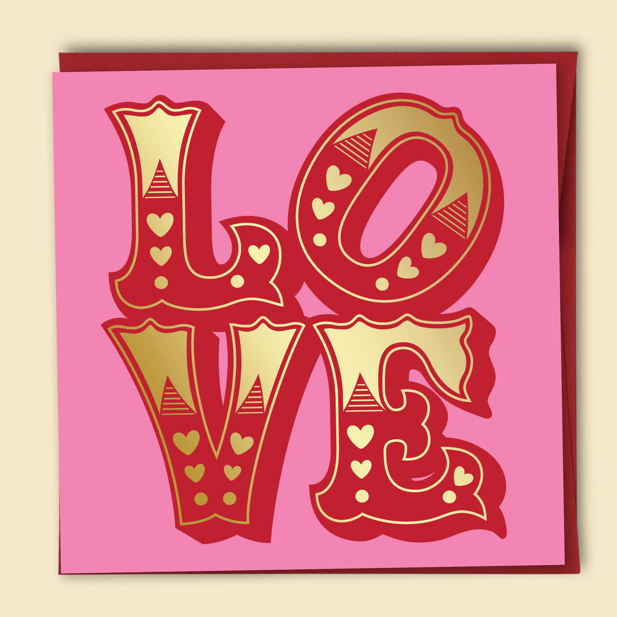 Card with 'LOVE' in red with gold foil details on a pink background. Australian-made greeting card by Papernest