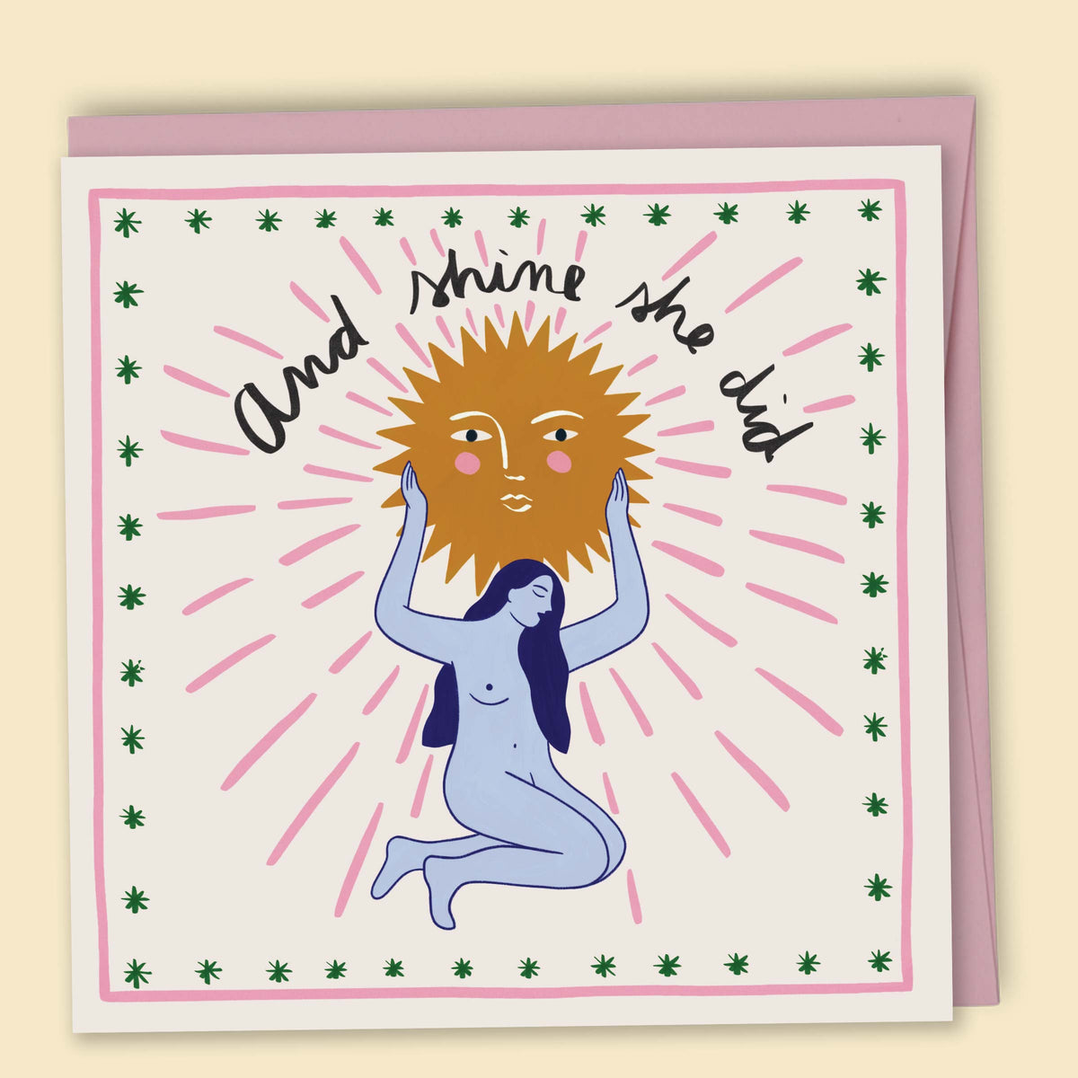 A greeting card with a hand-drawn illustration by Constanza Goeppinger, of a person holding the sun above their head, surrounded by green star-like shapes, with the text 'And she did.'. Australian-made greeting card by Papernest.