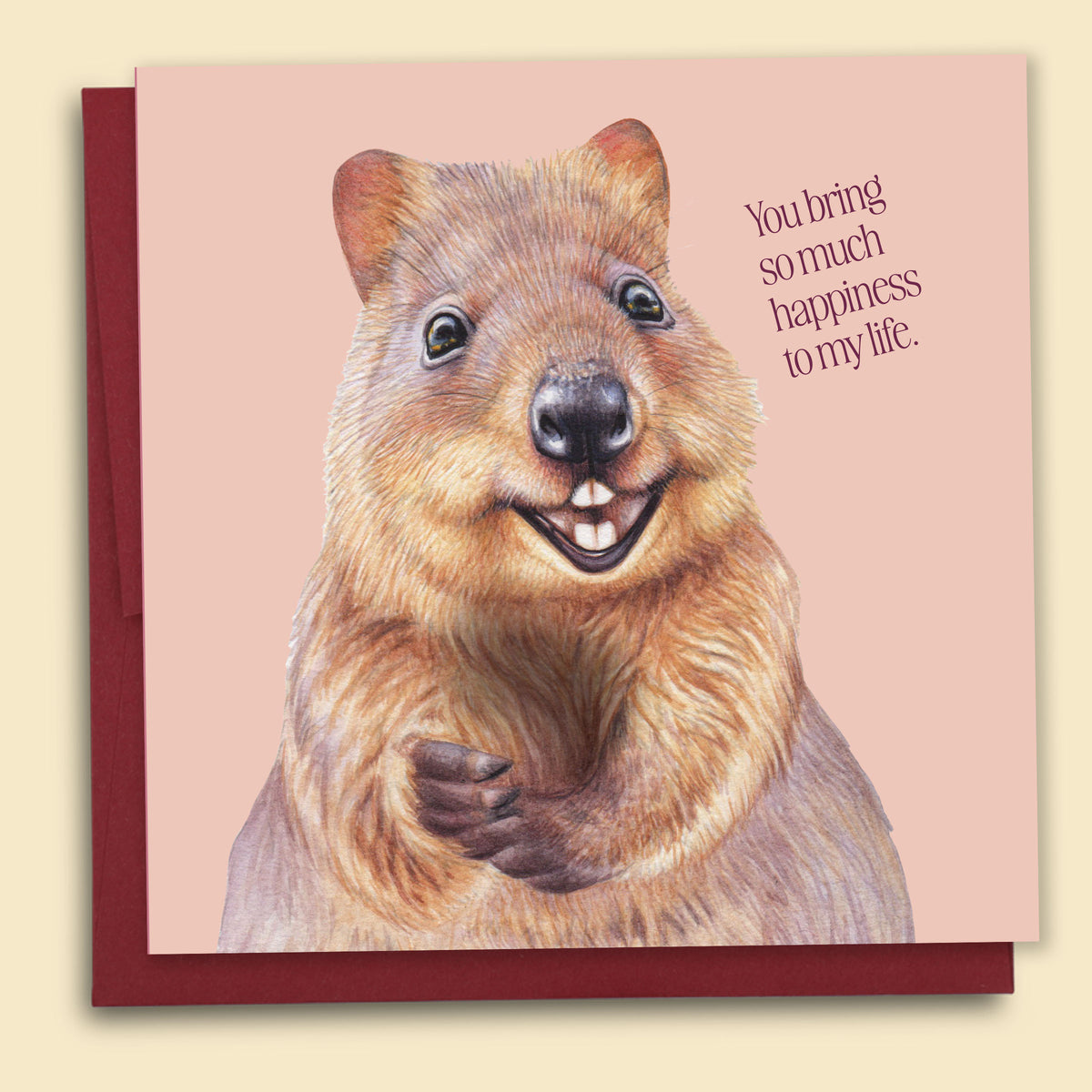 Greeting Card with a quokka illustration on a peach background. Greeting reads "You bring so much happiness to my life". Fun facts about the Quokka on the back of the card.