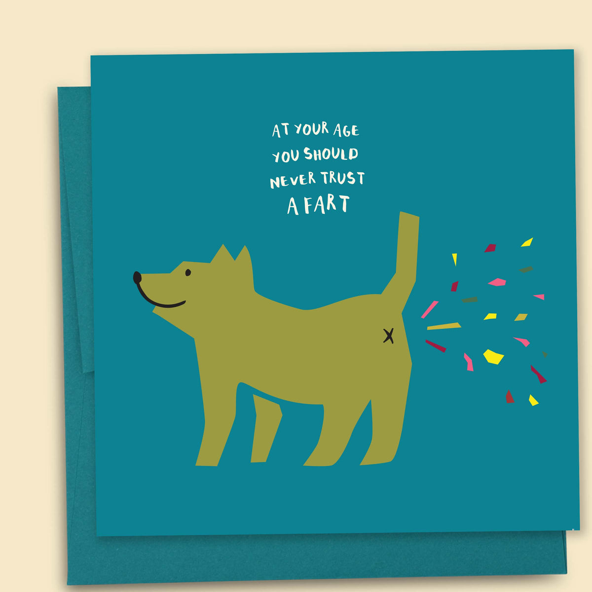 A greeting card with an illustration of a dog farting out confetti with the message 'At your age you should never trust a fart' Australian-made greeting card by Papernest