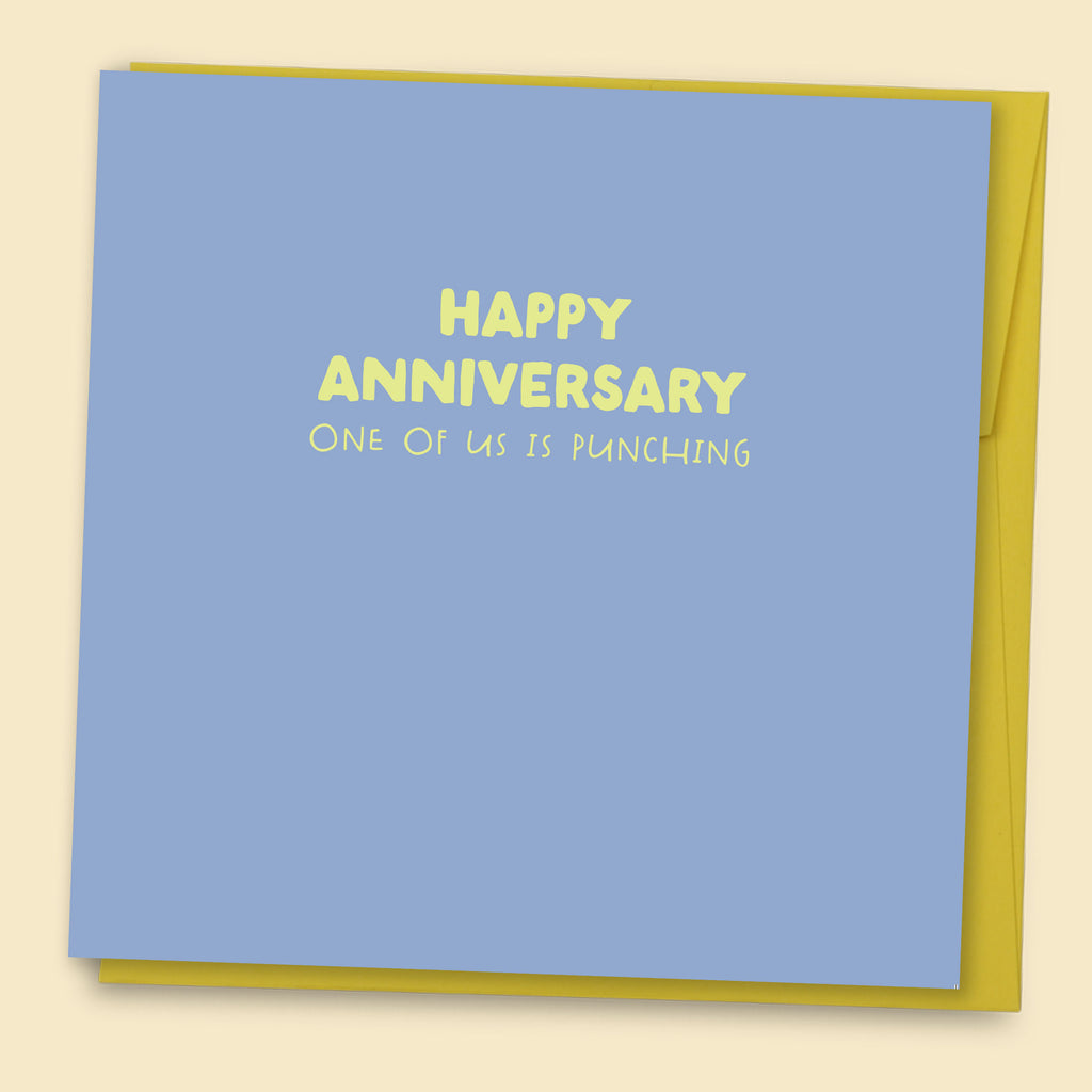 Funny anniversary card with blue background and yellow text reading Happy Anniversary One of Us is Punching with yellow envelope.