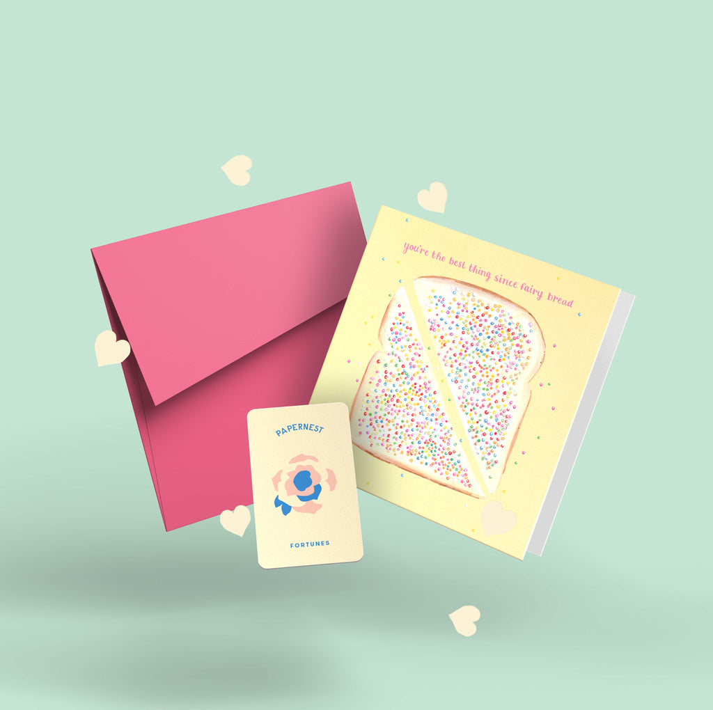 Funny Australian friendship card with watercolour fairy bread and hundreds and thousands, pink envelope, Papernest novelty fortune card, and plantable seed paper confetti hearts on mint green background
