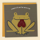 A greeting card with a cartoon frog design, with the text 'CONGRATS ON THE NEW PAD' across the top. The frog has a red heart balloon for a tongue  — Australian-made greeting card by Papernest