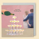 Illustrated champagne wedding card by Nat Pop reading 'On your wedding day'