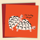 A greeting card with an illustration of two turtles and the phrase 'I'm turtley into you' — Australian-made greeting card by Papernest.